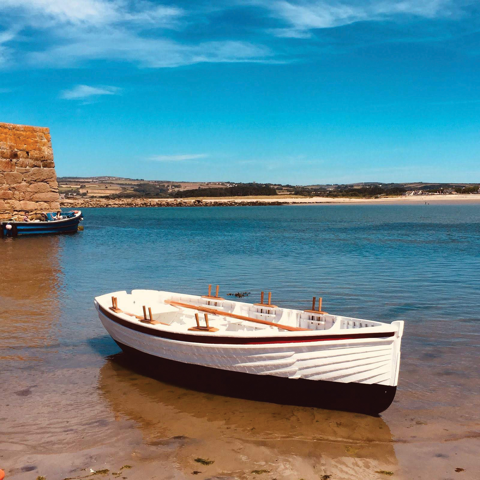 Beautiful view of a wooden row boat in shallow water